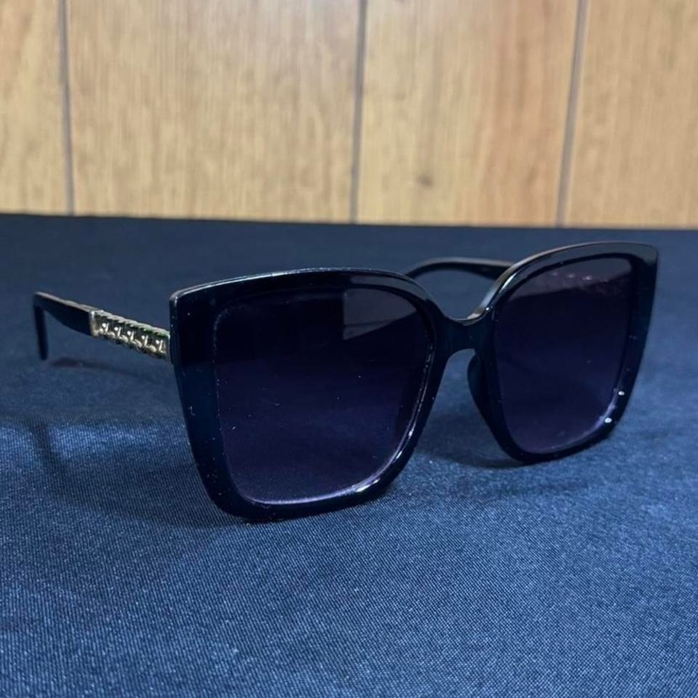 Black plastic sunglasses with gold chain detail